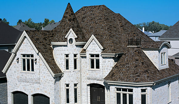 Luxury stone home with new shingle roof